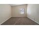 Bedroom features a window, neutral paint, and carpeting at 16 Bromack Se Dr, Atlanta, GA 30315