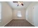 Clean, simple bedroom features neutral walls, carpeting, and a window for natural light at 16 Bromack Se Dr, Atlanta, GA 30315