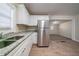 Well-lit kitchen area featuring granite countertops, stainless steel appliances, and wood flooring at 16 Bromack Se Dr, Atlanta, GA 30315