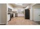 Bright kitchen features white cabinetry, stainless steel appliances, and hardwood floors at 16 Bromack Se Dr, Atlanta, GA 30315