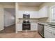 Clean kitchen featuring granite countertops, stainless steel appliances, and white cabinets at 16 Bromack Se Dr, Atlanta, GA 30315