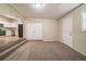 Cozy living room featuring plush carpeting and easy access to a modern, updated kitchen at 16 Bromack Se Dr, Atlanta, GA 30315