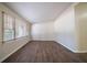 Bright living room with hardwood floors, a large window, and neutral colored walls at 16 Bromack Se Dr, Atlanta, GA 30315