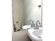 Small bathroom with toilet, sink, and mirror at 25 Quail Run, Decatur, GA 30035