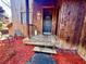 Inviting front entrance with a wooden porch and red mulch landscaping at 25 Quail Run, Decatur, GA 30035