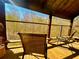 Relaxing screened-in porch with wooden flooring and wooded views at 25 Quail Run, Decatur, GA 30035