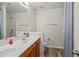 Bright bathroom with double sinks and a glass-enclosed shower at 2637 Cedar Dr, Lawrenceville, GA 30043