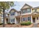 Two-story townhouses with stone accents and charming landscaping at 2637 Cedar Dr, Lawrenceville, GA 30043