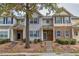 Three-story townhouses with stone and siding accents at 2637 Cedar Dr, Lawrenceville, GA 30043