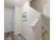 Welcoming hallway features wood flooring and staircase access to the second floor at 2637 Cedar Dr, Lawrenceville, GA 30043