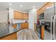 Updated kitchen featuring stainless steel appliances and wood cabinets at 2637 Cedar Dr, Lawrenceville, GA 30043