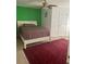 Bright bedroom with a comfortable bed and carpet flooring at 3825 Lavista Rd # O3, Tucker, GA 30084