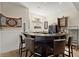 Entertain your guests in this bar featuring granite counters, chairs and modern appliances at 105 Weatherford Pl, Roswell, GA 30075