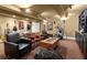 Relax in the finished basement with multiple seating options, guitars and lighting at 105 Weatherford Pl, Roswell, GA 30075