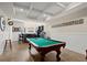 Finished basement complete with a pool table and wet bar for entertaining guests at 105 Weatherford Pl, Roswell, GA 30075