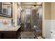 Elegant bathroom with a glass shower and pebble floor at 105 Weatherford Pl, Roswell, GA 30075