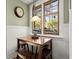 Charming breakfast nook with wood table and built-in window seat at 105 Weatherford Pl, Roswell, GA 30075