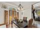 Elegant dining room featuring a dark wood table and French doors at 105 Weatherford Pl, Roswell, GA 30075