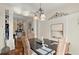 Bright dining room with chandelier and large art piece at 105 Weatherford Pl, Roswell, GA 30075