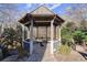 Charming gazebo surrounded by lush greenery, perfect for outdoor relaxation and intimate gatherings at 105 Weatherford Pl, Roswell, GA 30075