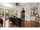 Bright living room featuring hardwood floors, modern furnishings, and a seamless connection to outdoor spaces at 105 Weatherford Pl, Roswell, GA 30075