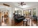 Bright living room featuring hardwood floors, modern furnishings, and a seamless connection to outdoor spaces at 105 Weatherford Pl, Roswell, GA 30075
