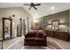 Beautiful main bedroom with a vaulted ceiling, french doors, neutral colors, and sitting area at 105 Weatherford Pl, Roswell, GA 30075