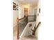 Upper level hallway with laundry closet and access to bedrooms at 12298 Centerra Dr, Hampton, GA 30228