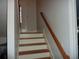 Simple wooden stairs with a wooden handrail at 3085 Everson Ct, Snellville, GA 30039