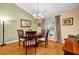 Charming dining room with hardwood floors and window seat at 5732 Village Loop, Fairburn, GA 30213