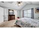 Charming main bedroom with a large window, a bed, and carpeted floors providing a comfortable and relaxing space at 5732 Village Loop, Fairburn, GA 30213