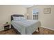 Comfortable bedroom with natural light, wood-look floors, and neutral decor for a serene space at 2555 Flat Shoals Rd # 802, Atlanta, GA 30349
