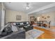 Spacious living room featuring hardwood floors, stylish decor, and ample natural light at 2555 Flat Shoals Rd # 802, Atlanta, GA 30349