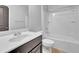 Cozy bathroom featuring a vanity with chrome faucet, a white toilet and a shower/tub combination at 3490 Buffington Ln, Cumming, GA 30040