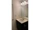 Bathroom featuring a vanity with a dark wood finish and ample lighting at 3490 Buffington Ln, Cumming, GA 30040