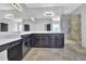 Bathroom boasts double vanity with cabinets and a glass enclosed shower at 3490 Buffington Ln, Cumming, GA 30040
