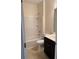 Bathroom with tub-shower combo, vanity, and neutral finishes at 3490 Buffington Ln, Cumming, GA 30040