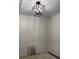 Bright room with modern light fixture and paint color palette samples at 3490 Buffington Ln, Cumming, GA 30040