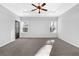 Spacious bedroom features a ceiling fan and two windows at 3490 Buffington Ln, Cumming, GA 30040