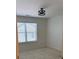 Bright bedroom with a modern light fixture and large window with natural light at 3490 Buffington Ln, Cumming, GA 30040