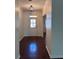 Bright foyer features hardwood floors, natural light, and access to the main living areas at 3490 Buffington Ln, Cumming, GA 30040