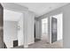Upstairs hallway with gray doors and trim, plush gray carpeting, and neutral colored walls at 3490 Buffington Ln, Cumming, GA 30040
