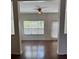 Open living area with hardwood floors, white trim, and lots of sunlight at 3490 Buffington Ln, Cumming, GA 30040