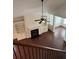 Open-concept living room with built-in shelves, a fireplace, and hardwood floors at 3490 Buffington Ln, Cumming, GA 30040