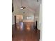 Spacious living room boasts high ceilings, natural light, hardwood floors, and a cozy fireplace at 3490 Buffington Ln, Cumming, GA 30040