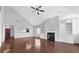 Spacious living room with hardwood flooring, fireplace, and ample natural light at 3490 Buffington Ln, Cumming, GA 30040