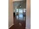 An open-concept living room features a vaulted ceiling, fireplace, and hardwood flooring at 3490 Buffington Ln, Cumming, GA 30040
