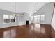 Bright living room featuring hardwood floors, fireplace, and an open floor plan at 3490 Buffington Ln, Cumming, GA 30040