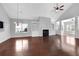 Open living room with hardwood floors, fireplace, built-in shelving, and lots of light at 3490 Buffington Ln, Cumming, GA 30040