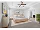 Main bedroom features a tray ceiling, ensuite bathroom, and modern decor at 3490 Buffington Ln, Cumming, GA 30040